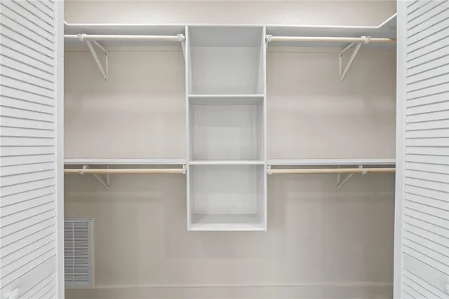 a view of an empty walk in closet