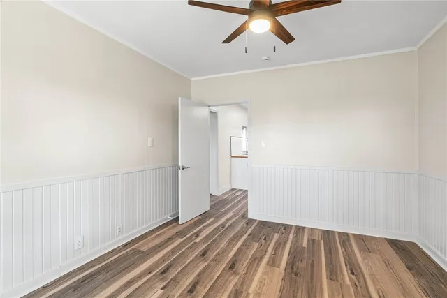 a view of a room with wooden floor