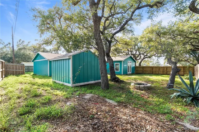 a view of a backyard with tree s