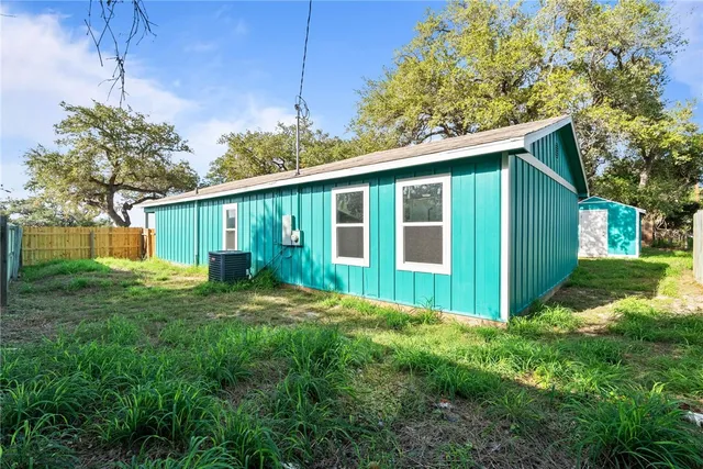a view of a house with yard and a garden