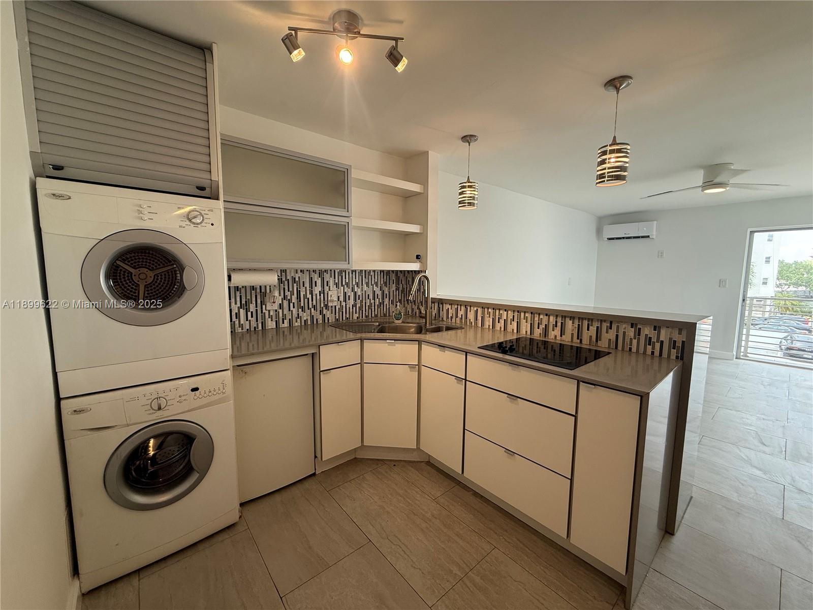 1441 Lincoln Road, Unit 317 Miami Beach, FL 33139 - Photo 11 of 31 a utility room with dryer and washer