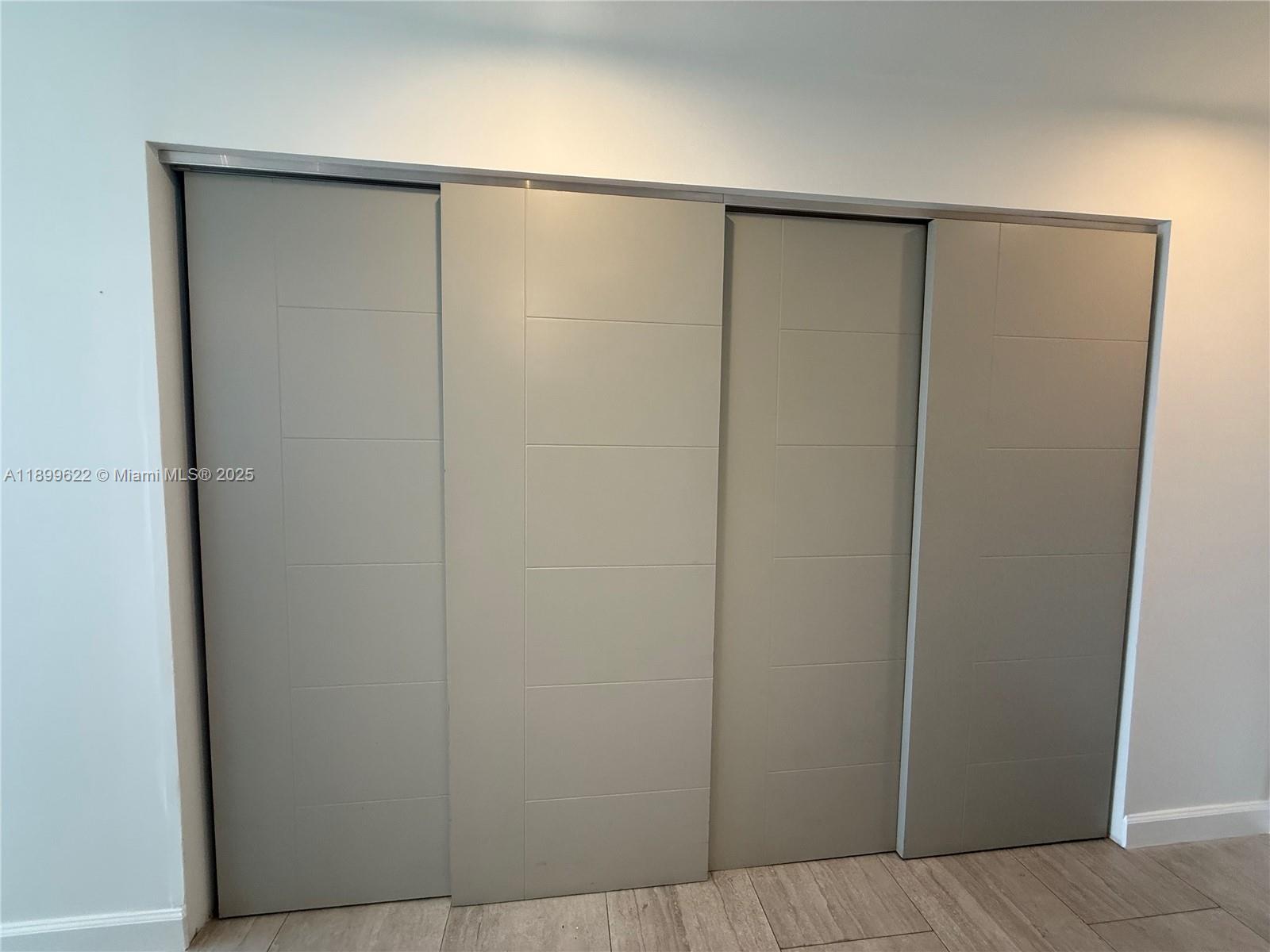 1441 Lincoln Road, Unit 317 Miami Beach, FL 33139 - Photo 13 of 31 a bathroom with a glass shower door