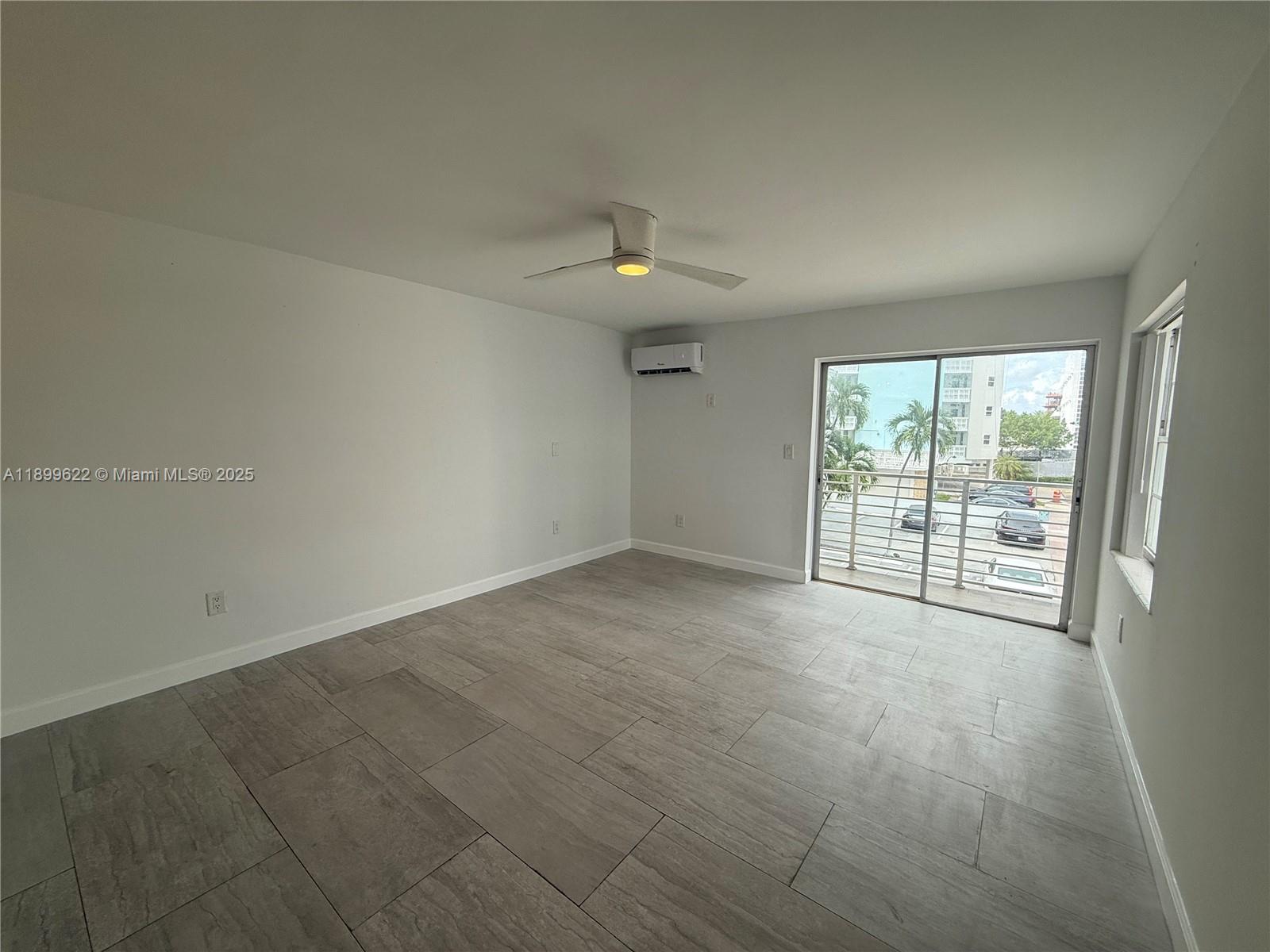 1441 Lincoln Road, Unit 317 Miami Beach, FL 33139 - Photo 17 of 31 a view of an empty room with a window