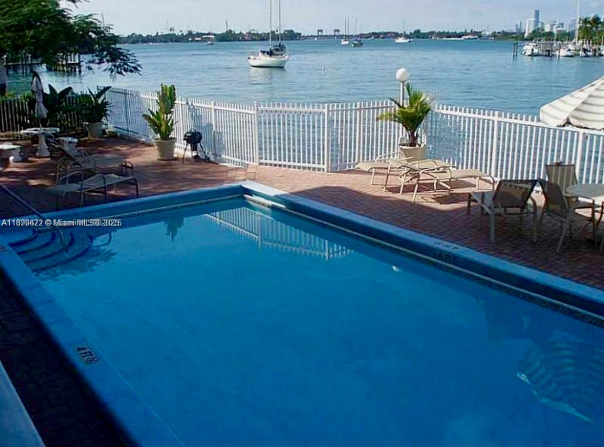 1441 Lincoln Road, Unit 317 Miami Beach, FL 33139 - Photo 24 of 31 a view of a lake with a terrace