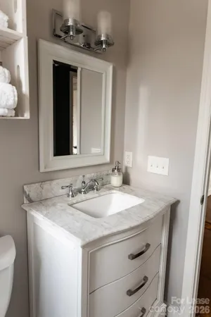 a bathroom with a toilet and a sink