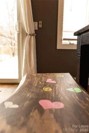 a view of a room with wooden floor