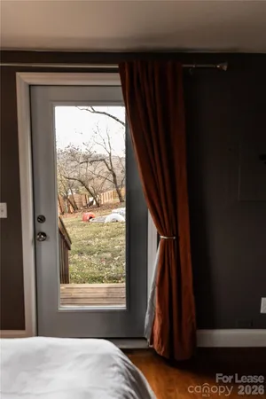 a bedroom with a bed and flat screen tv
