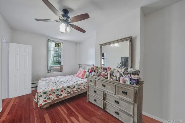 a bedroom with bed and window