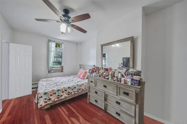 a bedroom with bed and window