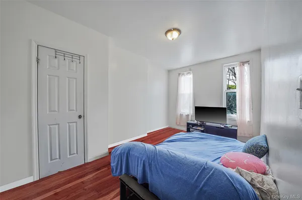 a bedroom with a bed and a closet