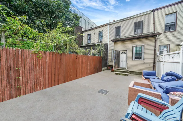 a backyard of a house with seating space