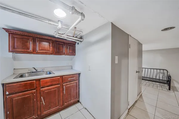 a view of a hallway to a room with a car parked in living room