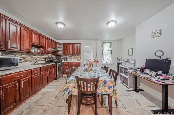 a kitchen with a dining table and chairs
