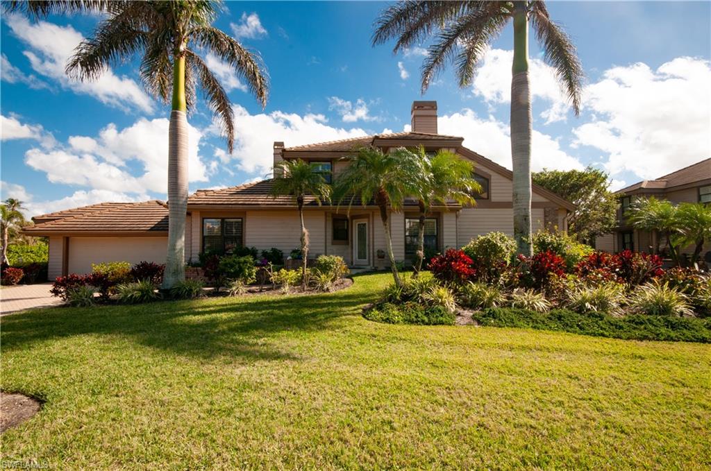 4022 Crayton Road Naples, FL 34103 - Photo 2 of 28 a view of a house with a yard and sitting area