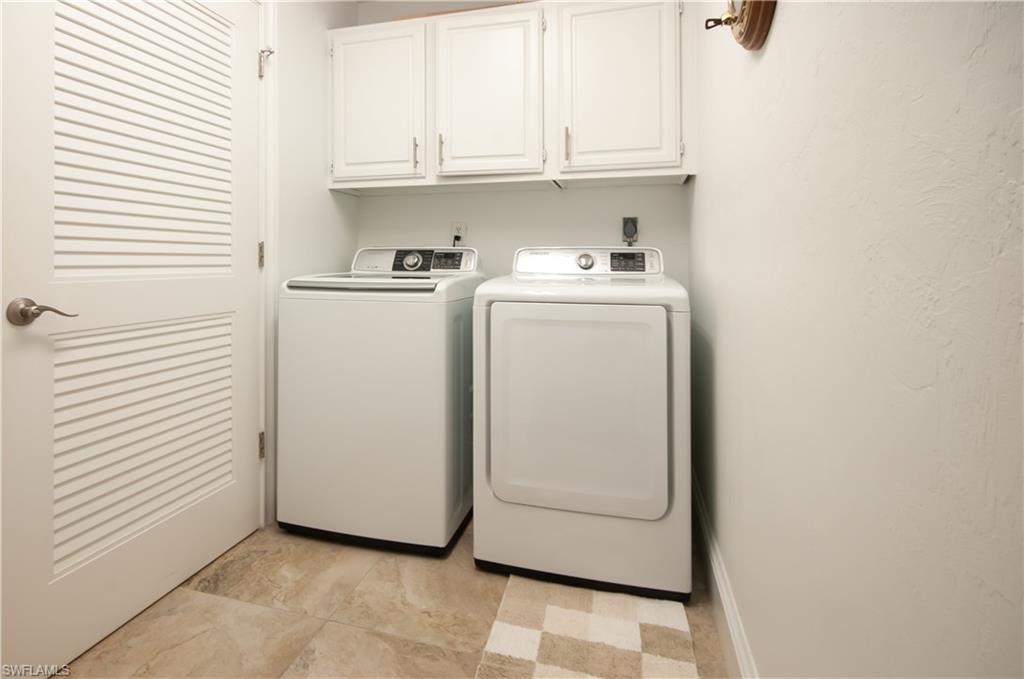 4022 Crayton Road Naples, FL 34103 - Photo 23 of 28 a utility room with dryer and washer