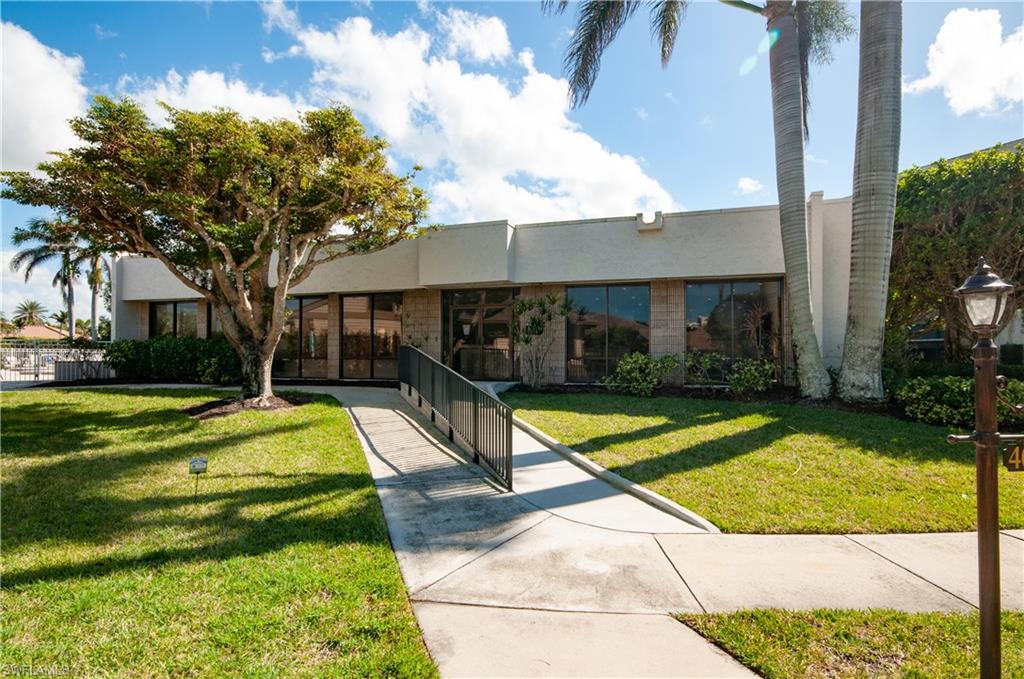 4022 Crayton Road Naples, FL 34103 - Photo 25 of 28 a view of swimming pool with a yard