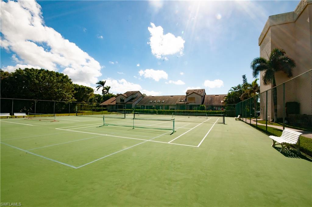 4022 Crayton Road Naples, FL 34103 - Photo 26 of 28 a view of a tennis court