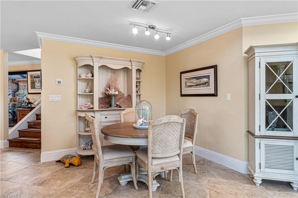4022 Crayton Road Naples, FL 34103 - Photo 7 of 28 a dining room with furniture and window