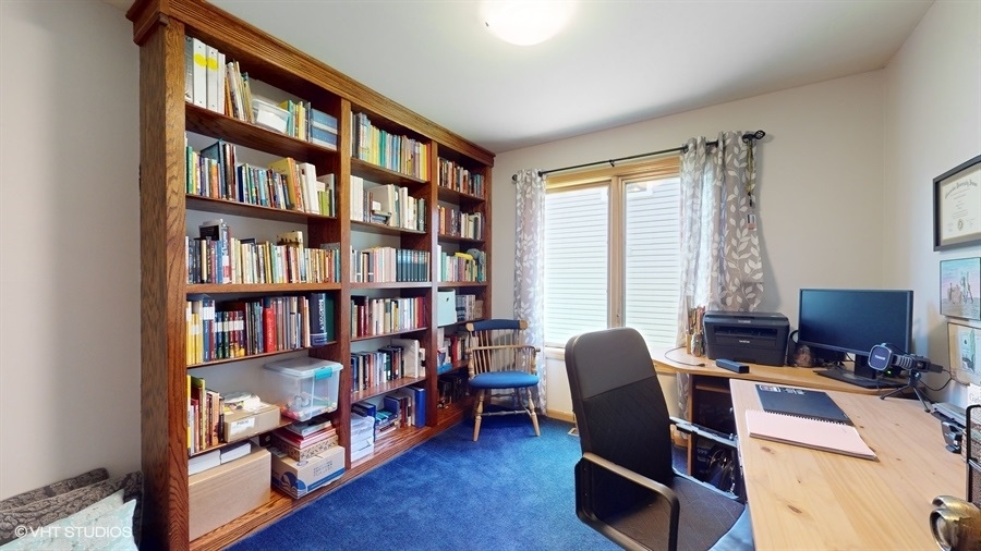 545 Abbey Road Bartlett, IL 60103 - Photo 12 of 28 a view of a livingroom with workspace and a window