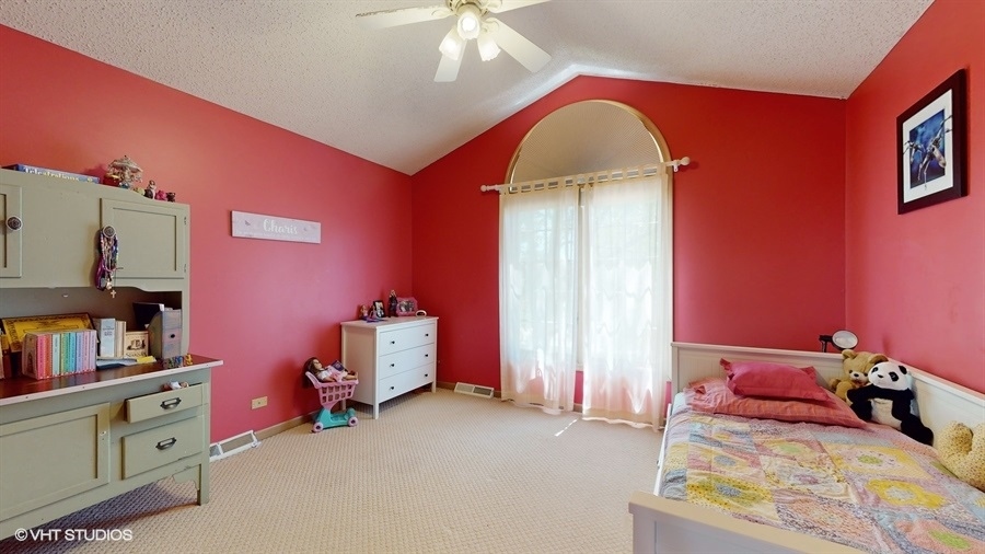 545 Abbey Road Bartlett, IL 60103 - Photo 20 of 28 a bedroom with bed and a window
