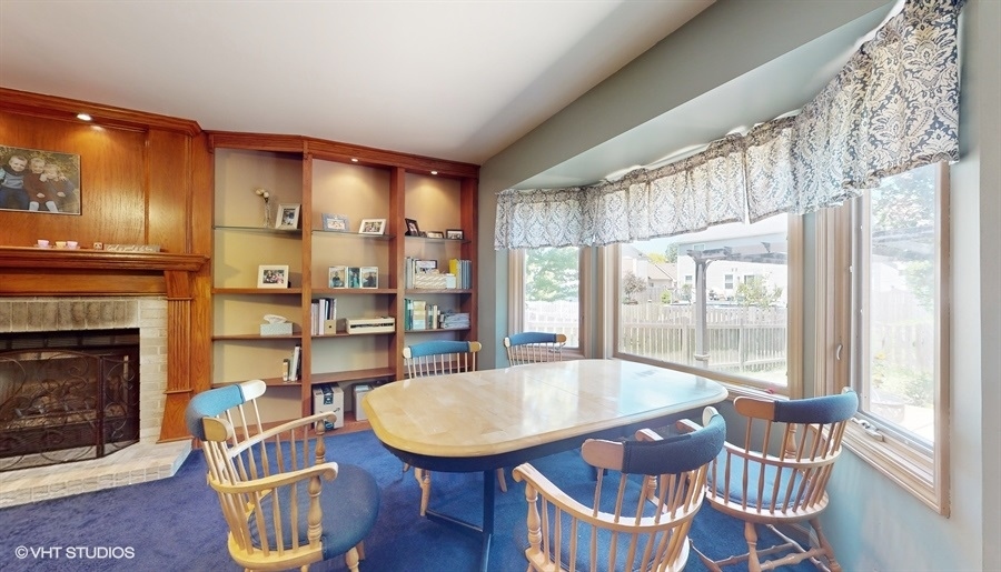 545 Abbey Road Bartlett, IL 60103 - Photo 6 of 28 a view of a dining room with furniture window and wooden floor