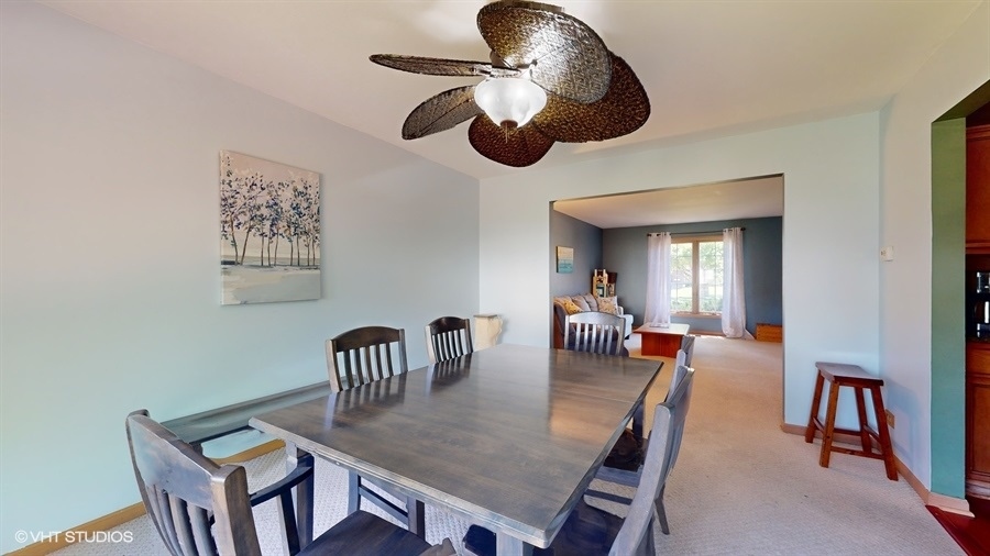 545 Abbey Road Bartlett, IL 60103 - Photo 8 of 28 a view of a dining room with furniture and chandelier
