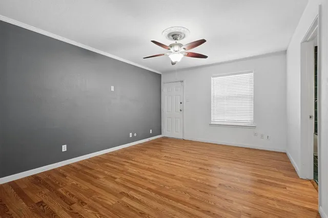 a bathroom with a tub and glass door