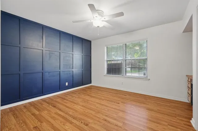a view of porch with wooden floor and floor to ceiling window
