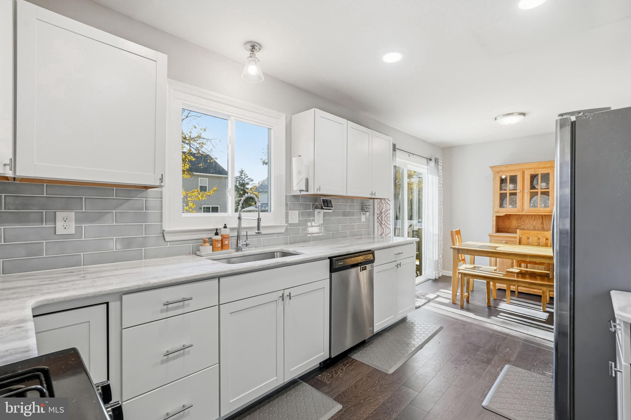16 Sumner Avenue Berlin, NJ 08009 - Photo 13 of 30 a kitchen with a sink stove and cabinets
