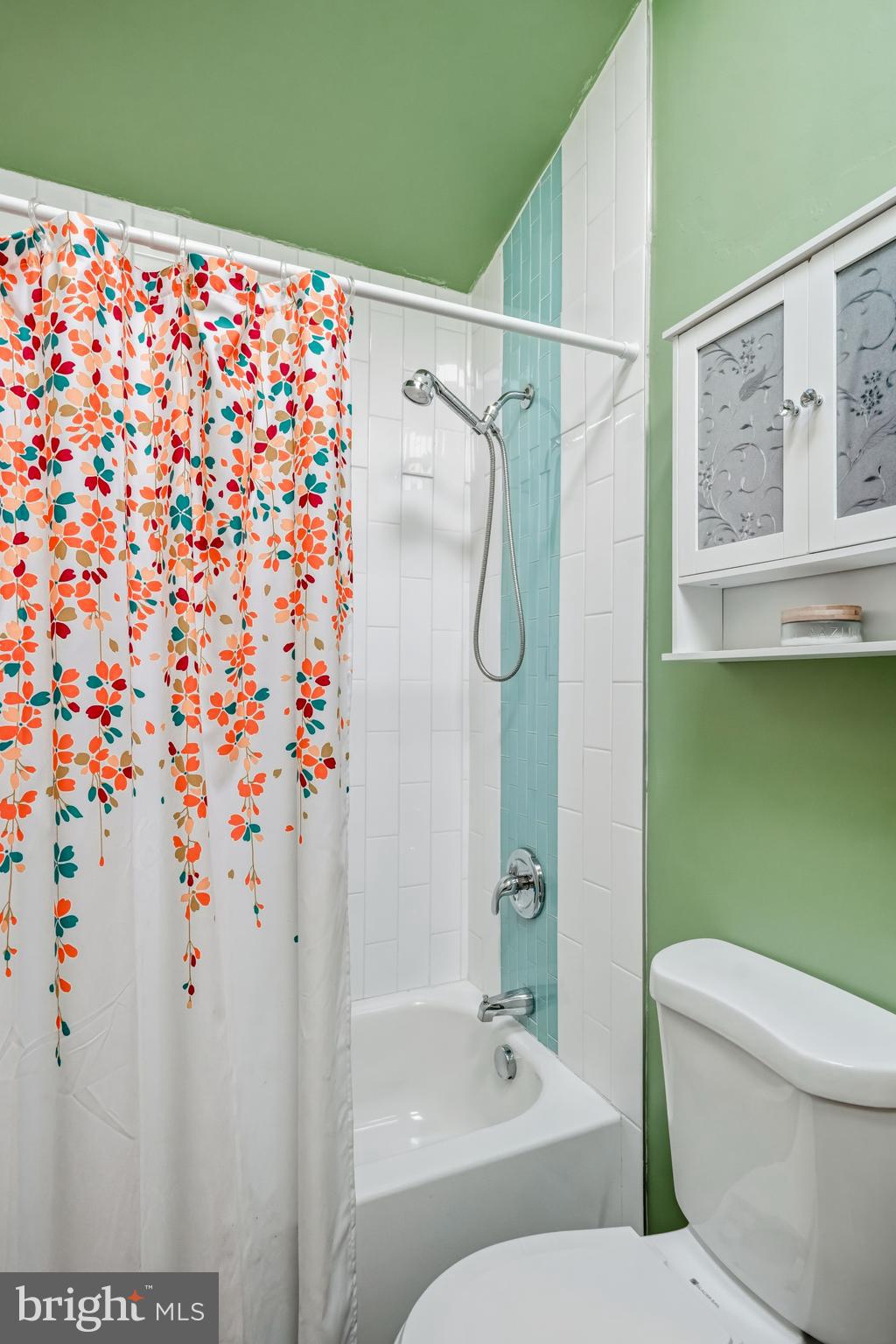 16 Sumner Avenue Berlin, NJ 08009 - Photo 19 of 30 a bathroom with a shower curtain a sink and a toilet