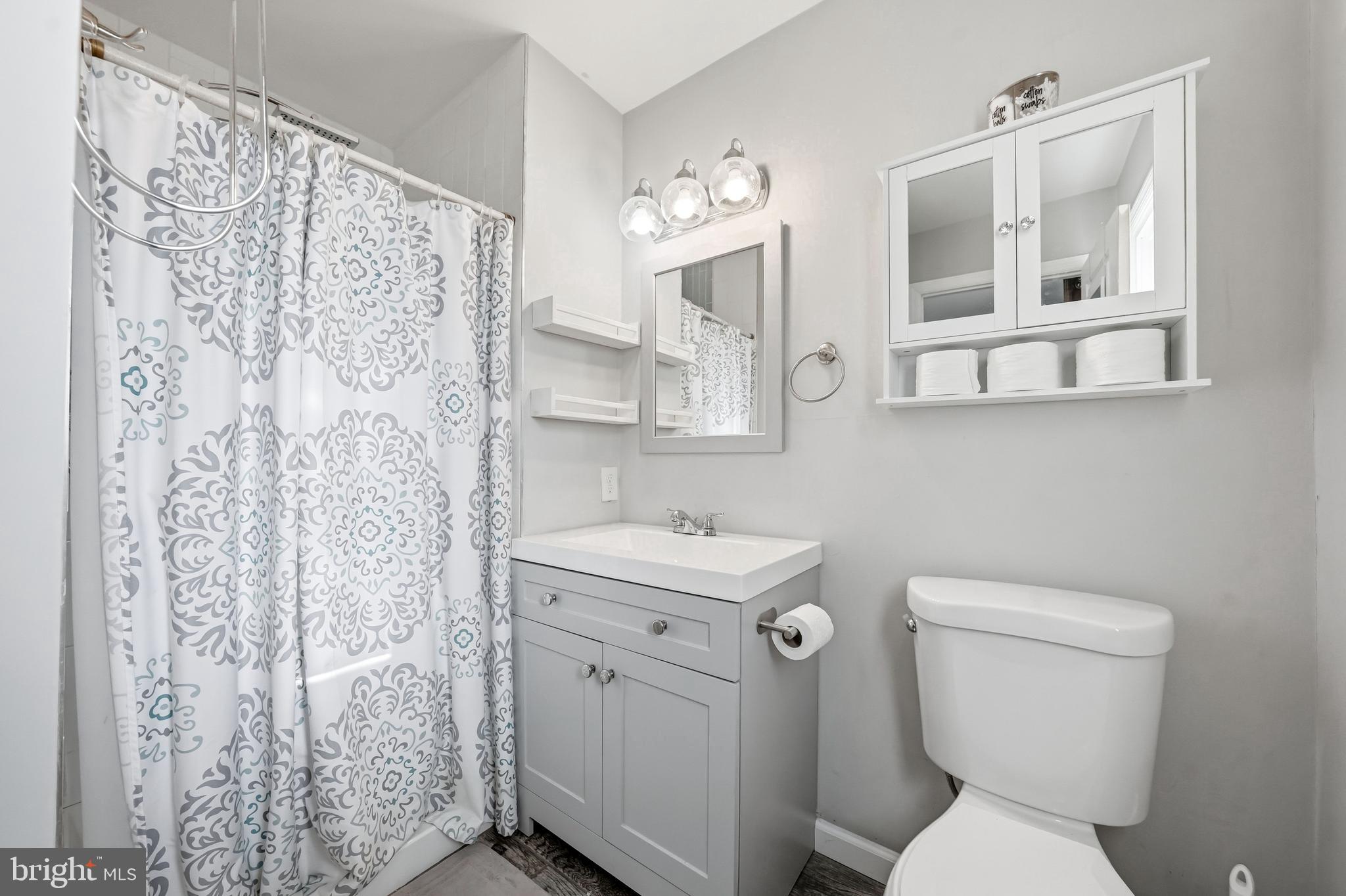 16 Sumner Avenue Berlin, NJ 08009 - Photo 21 of 30 a bathroom with a toilet sink and mirror
