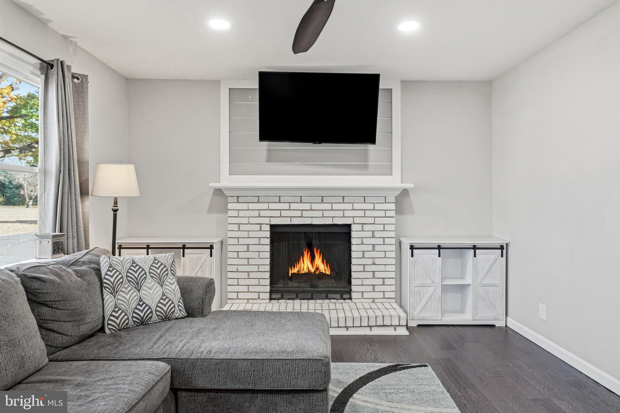 16 Sumner Avenue Berlin, NJ 08009 - Photo 6 of 30 a living room with furniture and a fireplace