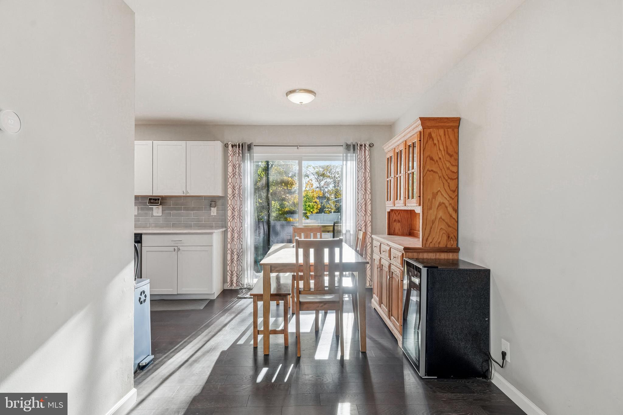 16 Sumner Avenue Berlin, NJ 08009 - Photo 8 of 30 a kitchen with a table chairs refrigerator and cabinets