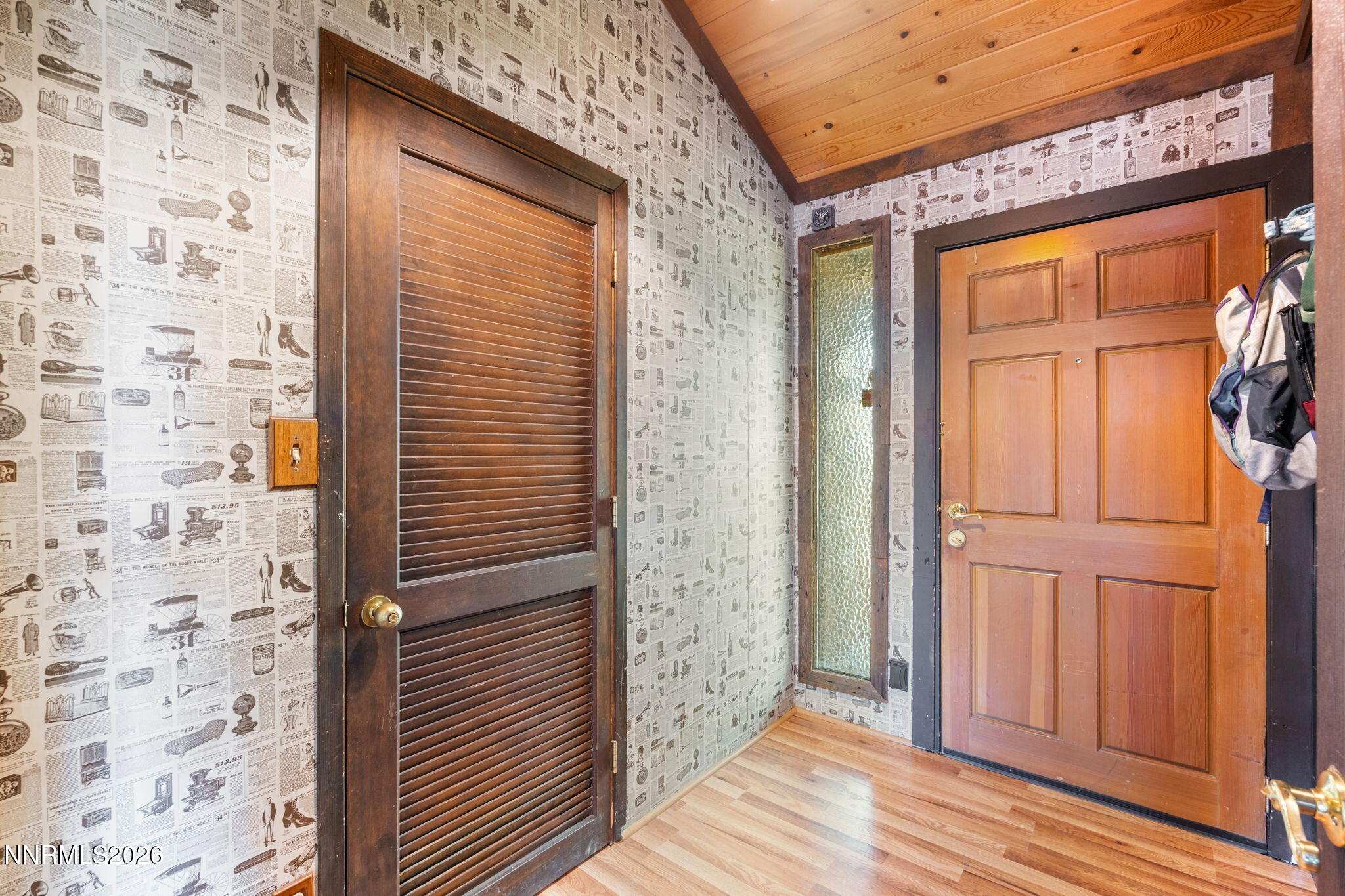 21845 Adobe Road Reno, NV 89521 - Photo 18 of 65 a view of a hallway with wooden floor and entryway