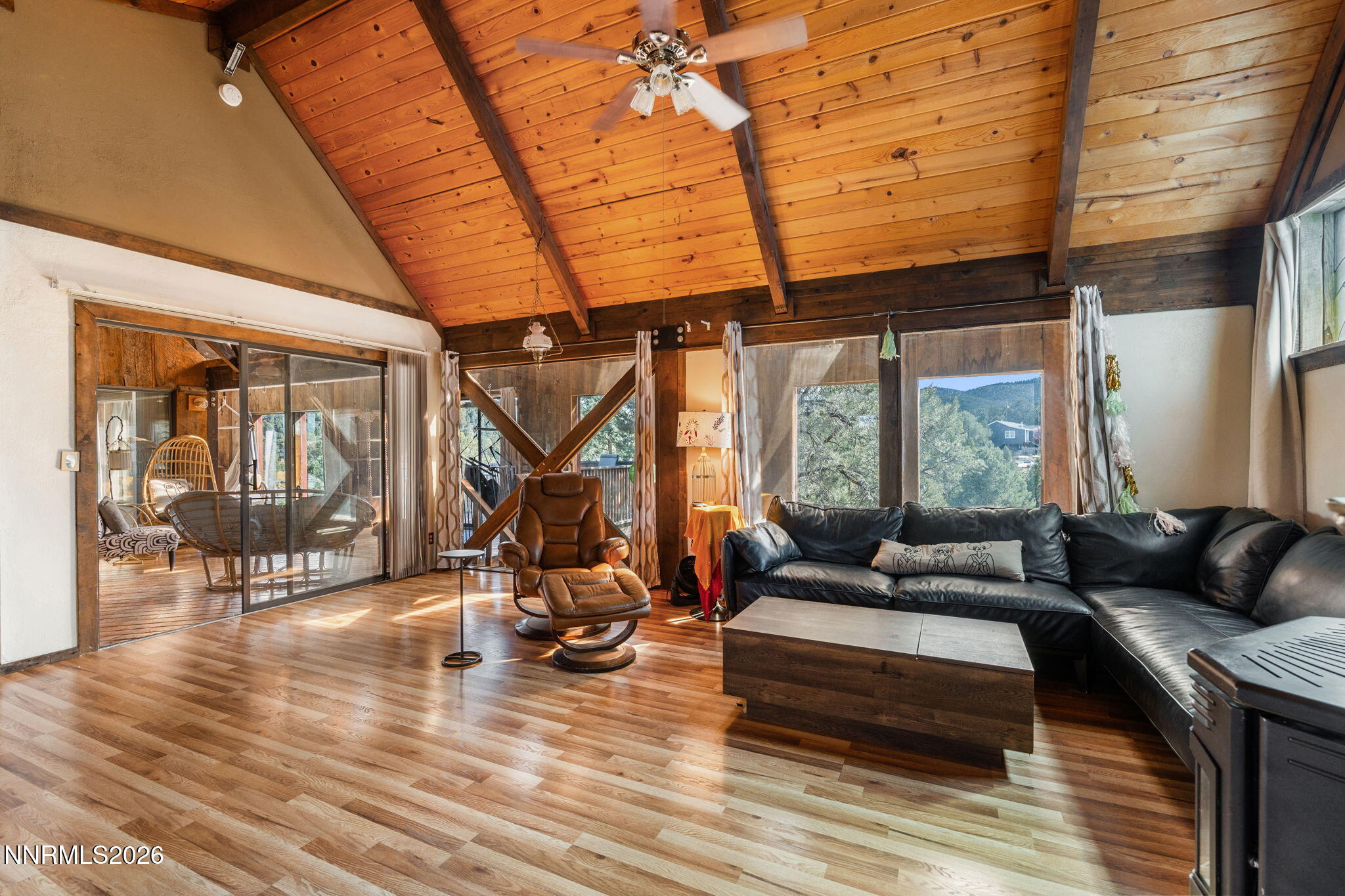 21845 Adobe Road Reno, NV 89521 - Photo 20 of 65 a living room with furniture a wooden floor and a large window