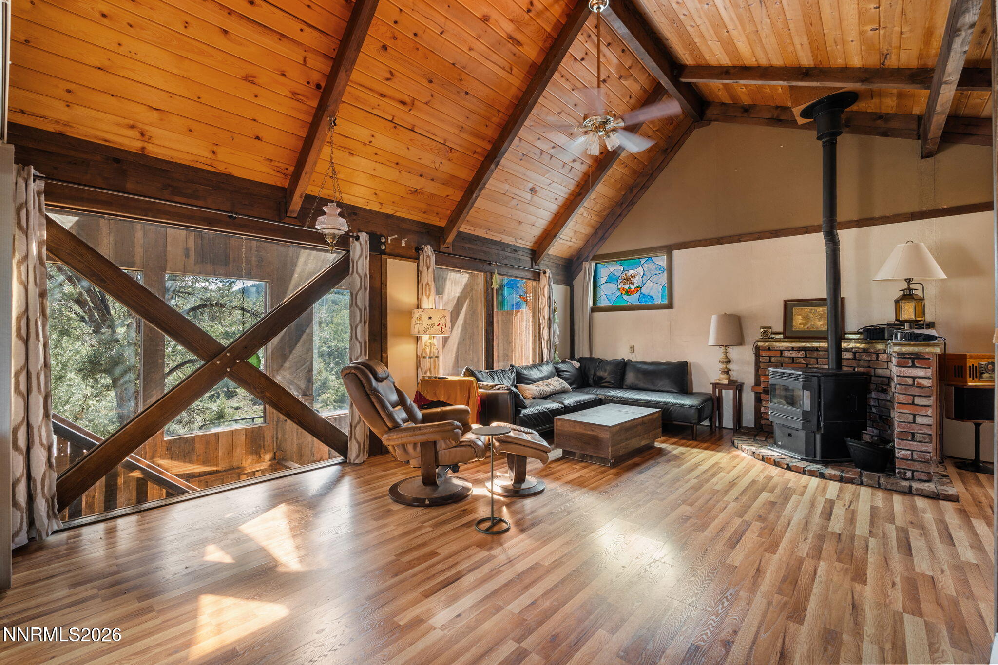 21845 Adobe Road Reno, NV 89521 - Photo 22 of 65 a living room with furniture a wooden floor and next to a window