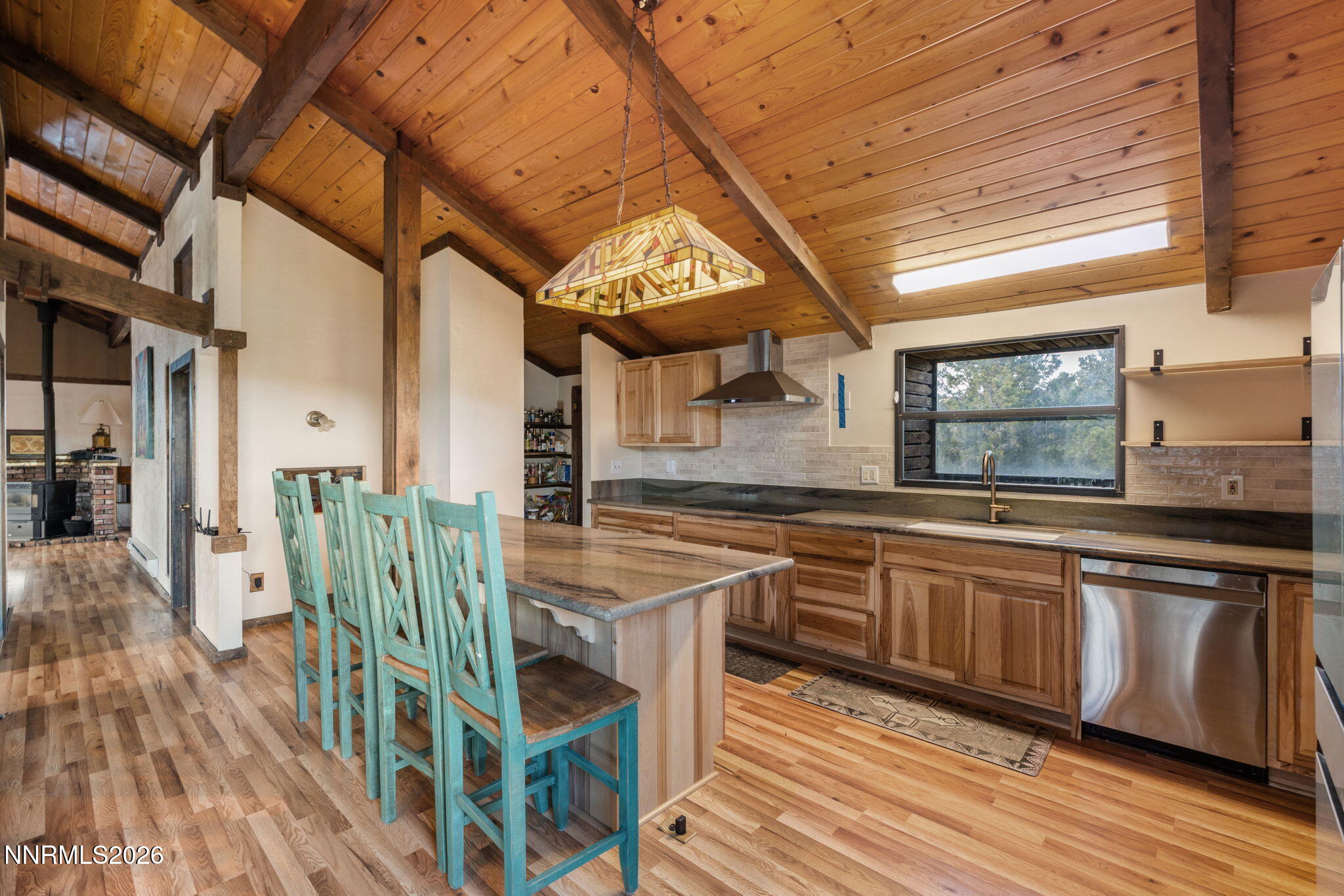 21845 Adobe Road Reno, NV 89521 - Photo 27 of 65 a open kitchen with stainless steel appliances granite countertop a stove and cabinets
