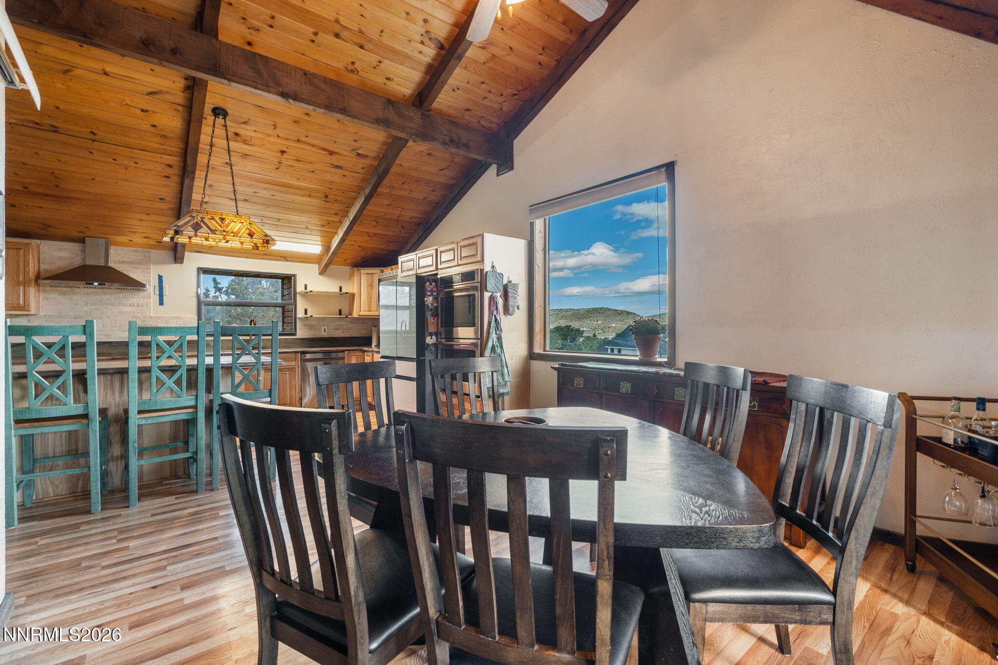 21845 Adobe Road Reno, NV 89521 - Photo 32 of 65 a view of a dining room with furniture window and outside view