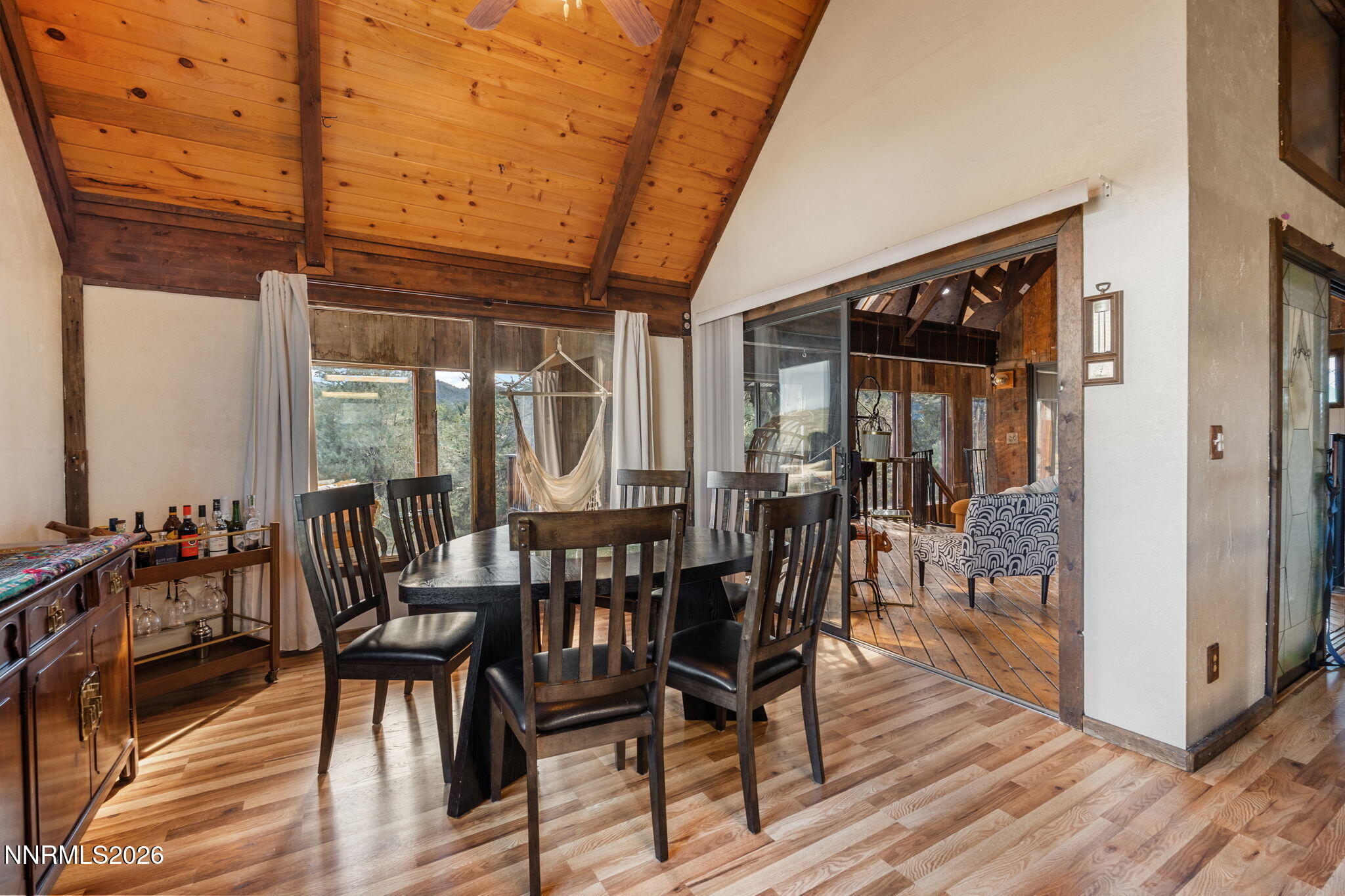 21845 Adobe Road Reno, NV 89521 - Photo 34 of 65 a dining room with furniture wooden floor and a rug