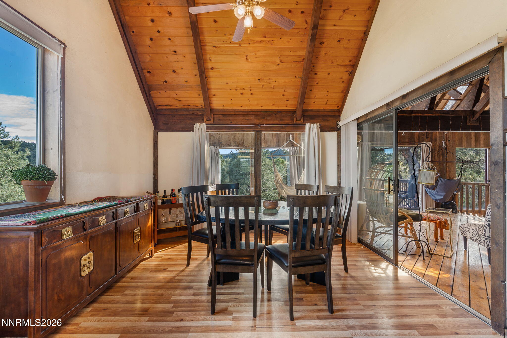 21845 Adobe Road Reno, NV 89521 - Photo 35 of 65 a view of a dining room with furniture window and wooden floor