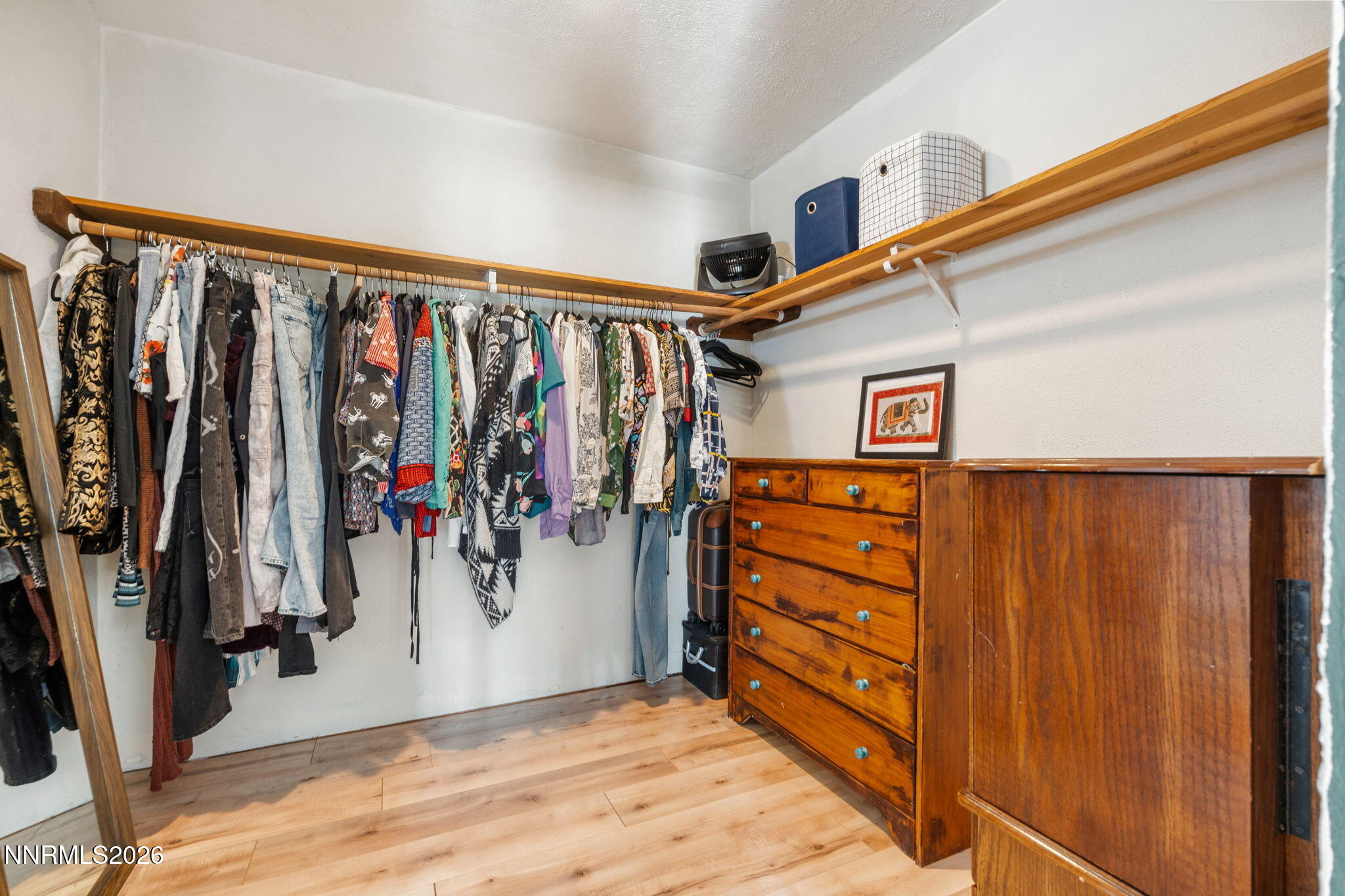 21845 Adobe Road Reno, NV 89521 - Photo 44 of 65 a view of walk in closet with clothes and shoes