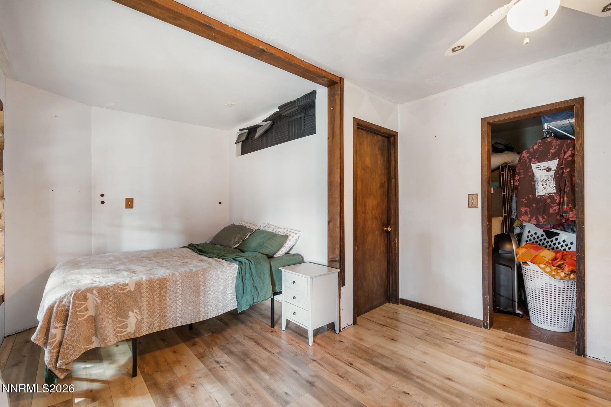 21845 Adobe Road Reno, NV 89521 - Photo 51 of 65 a bedroom with a bed and wooden floor