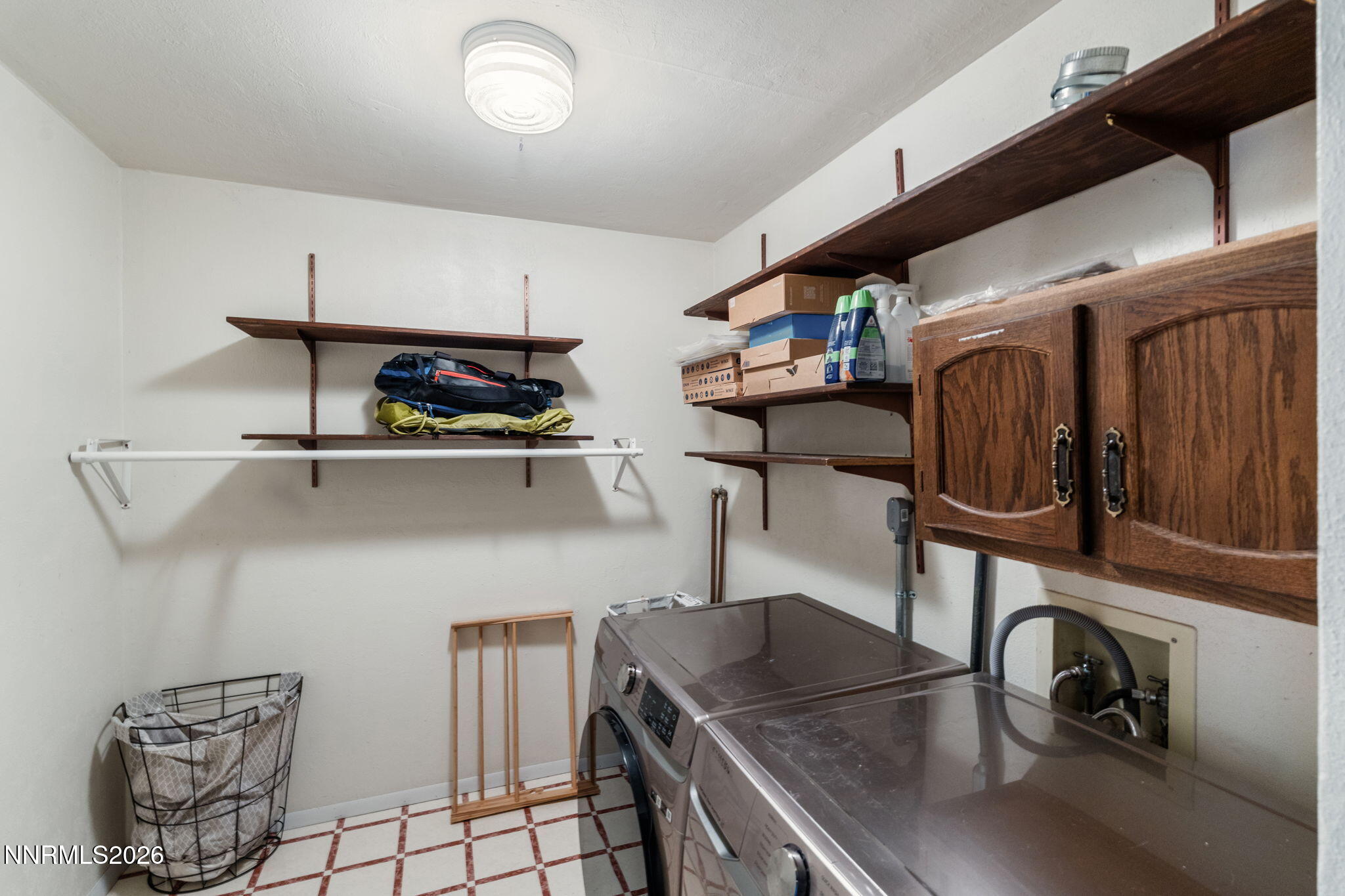 21845 Adobe Road Reno, NV 89521 - Photo 57 of 65 a kitchen with stainless steel appliances granite countertop a sink cabinets and wooden floor