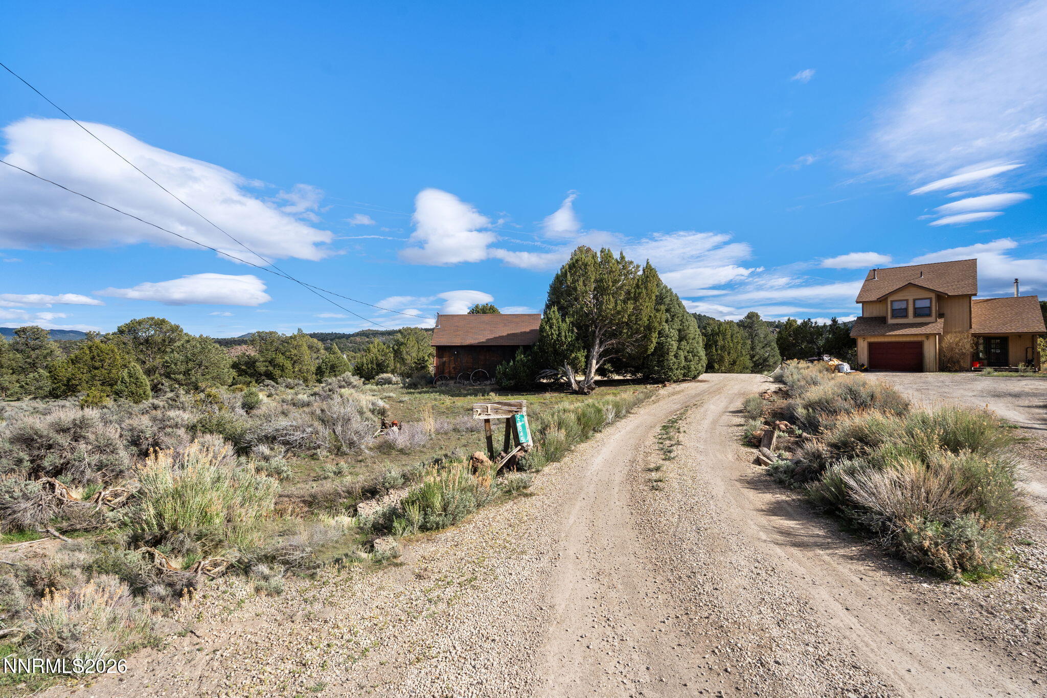 21845 Adobe Road Reno, NV 89521 - Photo 6 of 65 a view of a road with a building in the background