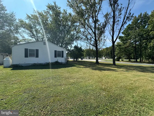 a view of outdoor space with deck and yard