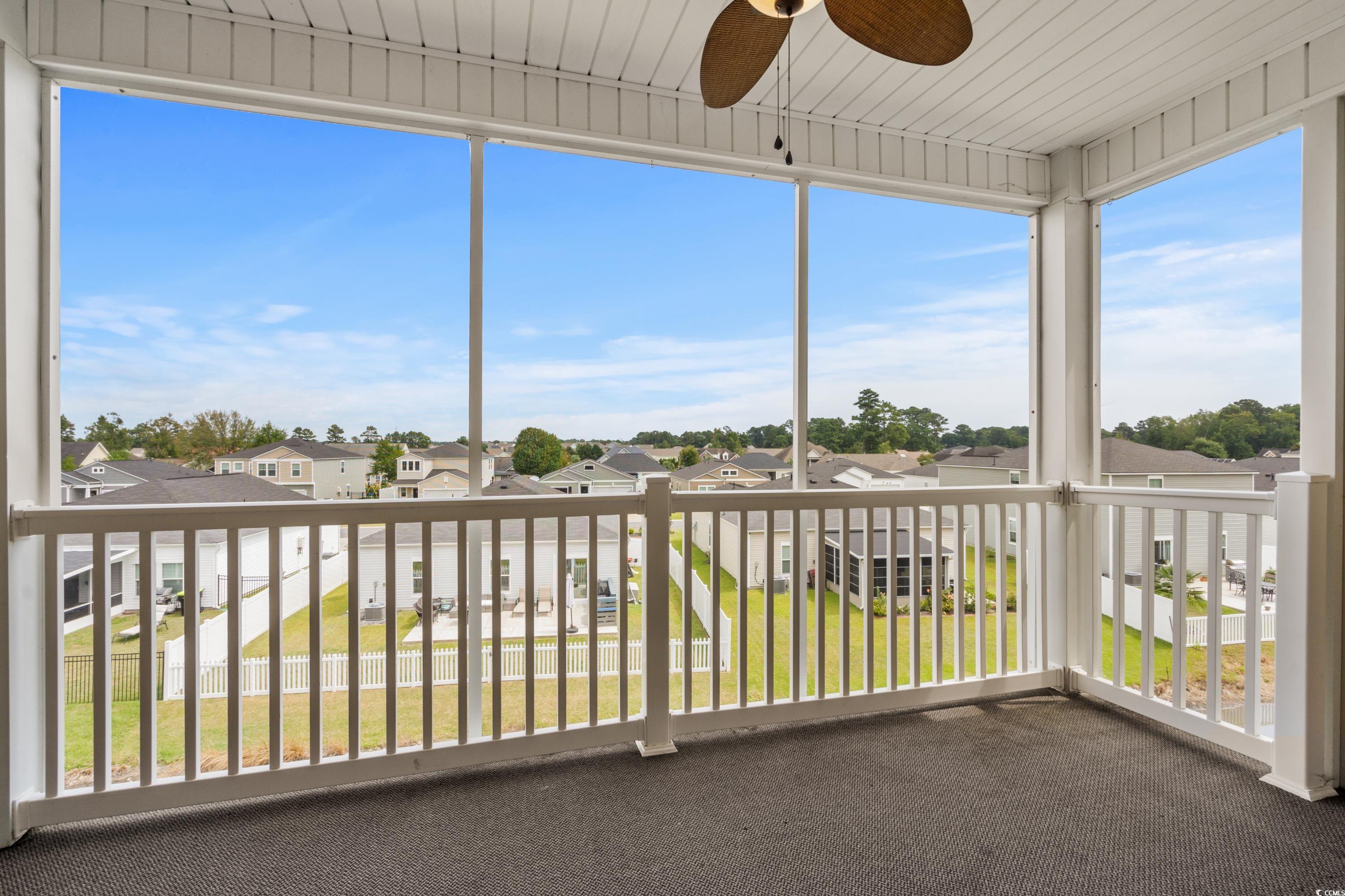 2050 Cross Gate Boulevard, Unit 303 Myrtle Beach, SC 29575 - Photo 16 of 35 Unfurnished sunroom with a healthy amount of sunlight and ceiling fan
