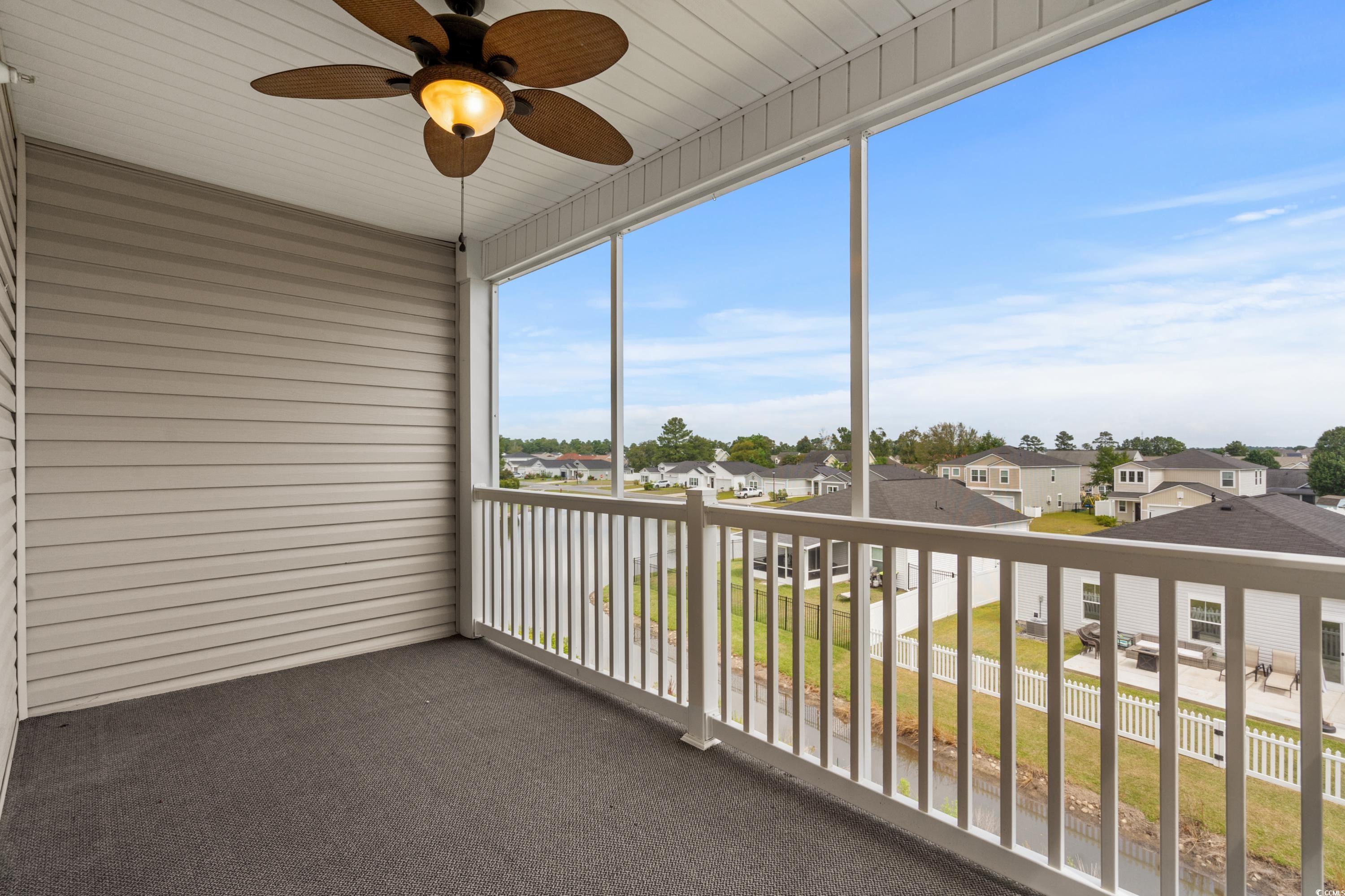 2050 Cross Gate Boulevard, Unit 303 Myrtle Beach, SC 29575 - Photo 18 of 35 Unfurnished sunroom featuring ceiling fan