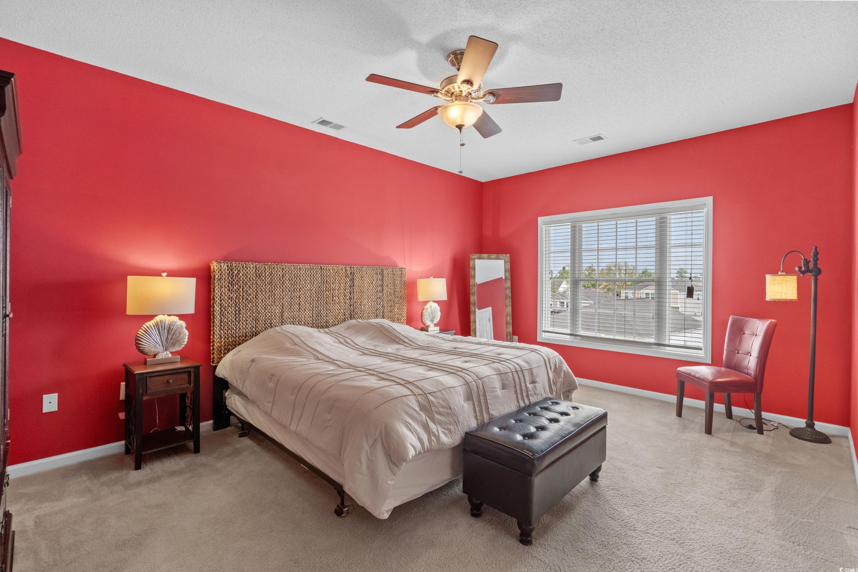 2050 Cross Gate Boulevard, Unit 303 Myrtle Beach, SC 29575 - Photo 20 of 35 Carpeted bedroom with a textured ceiling and ceiling fan