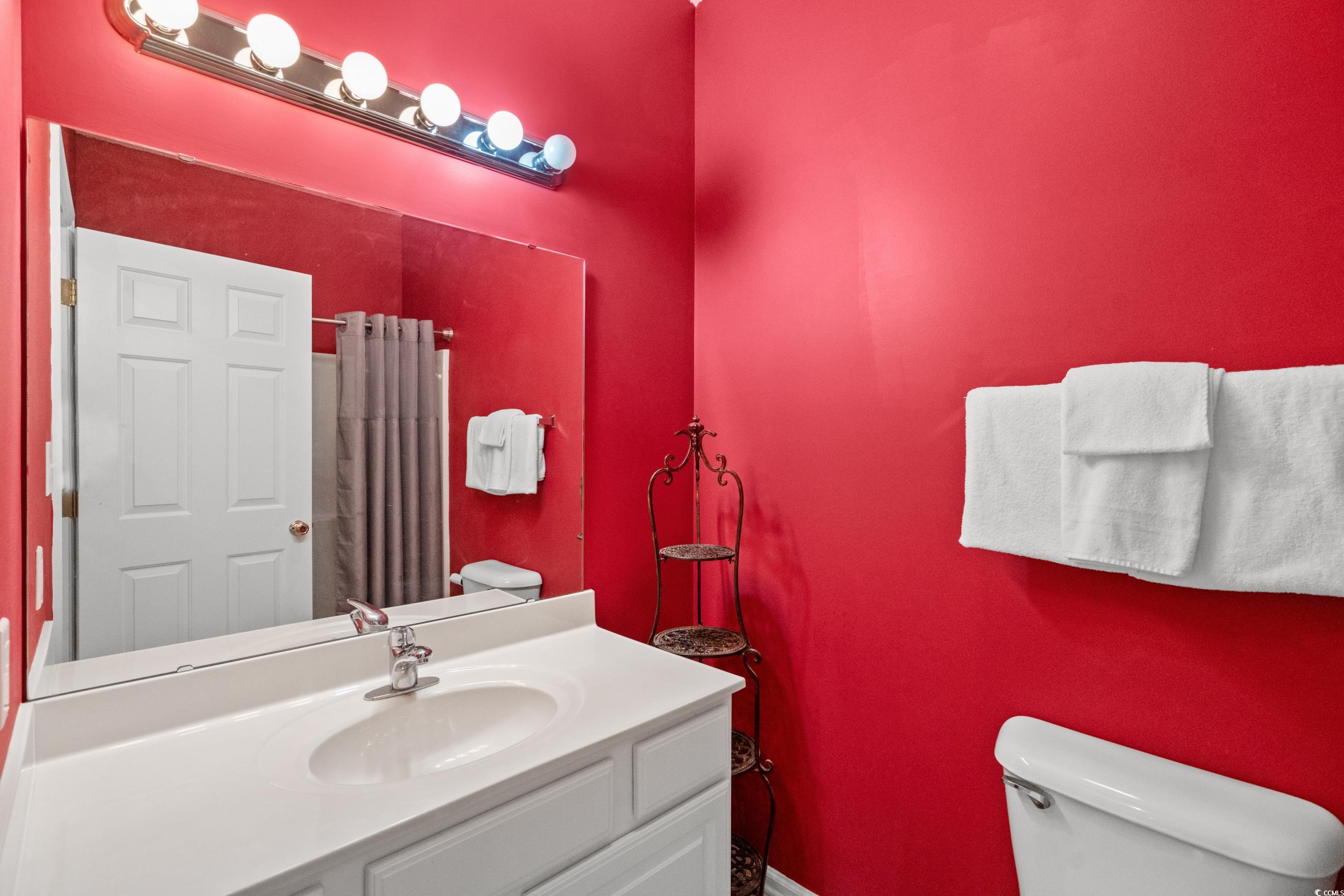 2050 Cross Gate Boulevard, Unit 303 Myrtle Beach, SC 29575 - Photo 26 of 35 Bathroom featuring toilet and vanity