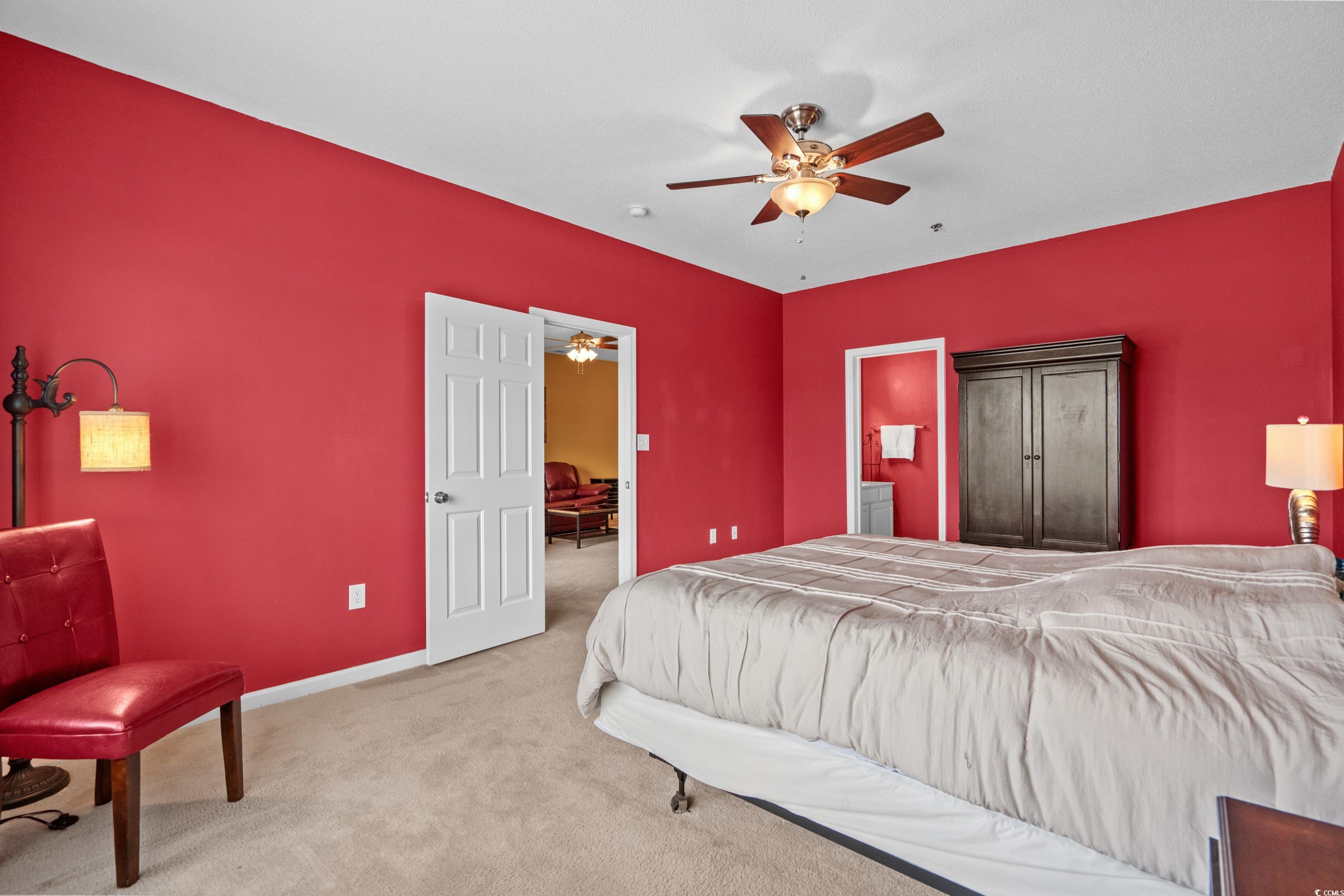 2050 Cross Gate Boulevard, Unit 303 Myrtle Beach, SC 29575 - Photo 28 of 35 Bedroom featuring ceiling fan and carpet floors